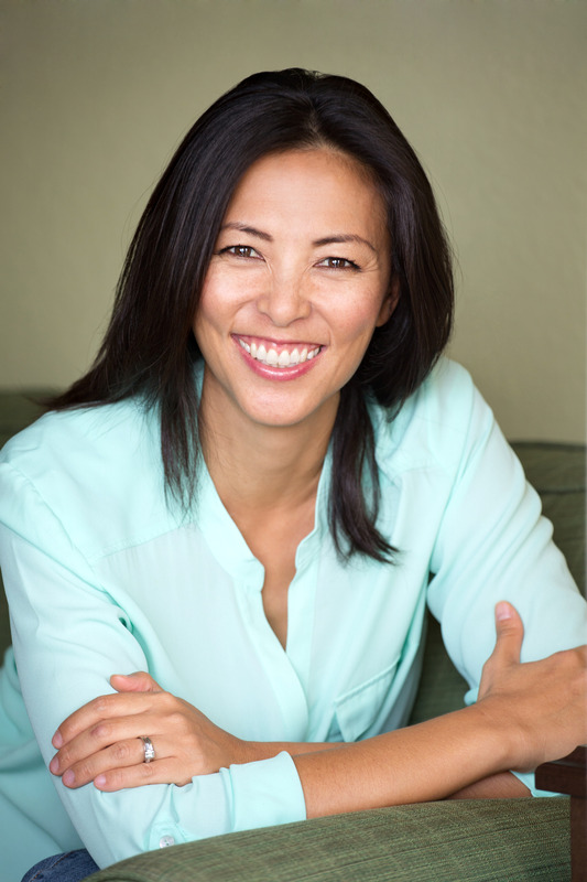 Portrait of an Asian woman smiling.