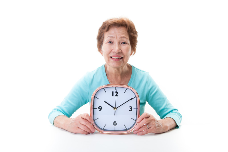Clock and elderly women