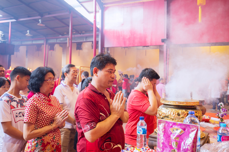 Chinese people praying at temple