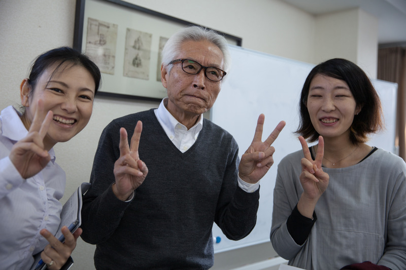 Japanese people pose peace sign for picture