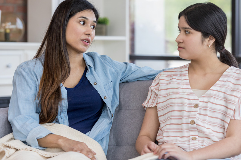 Mid adult mom has serious talk with teen daughter
