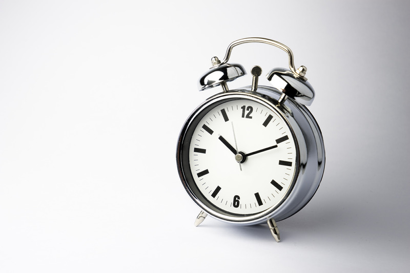 Metal Alarm clock, work & wake up time, white background